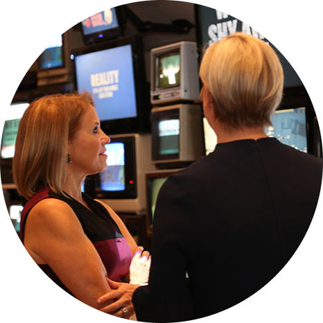Katie Couric and Carolyn Tastad, P&G Group President North America, take in the Women at Work: Myth vs. Reality Interactive Exhibit